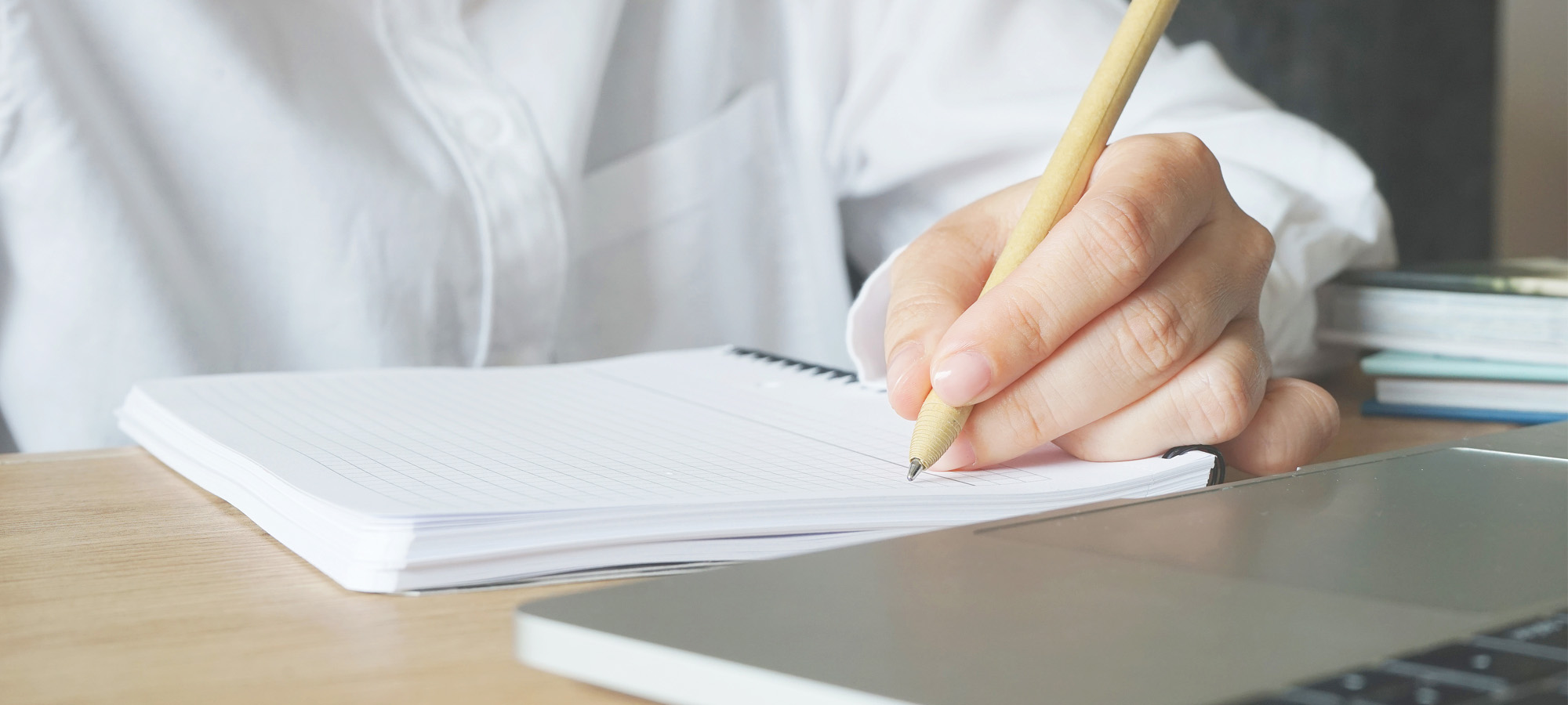 A female programmer calmly making a checklist of issues to solve
